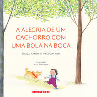 Capa do livro A alegria de um cachorro com uma bola na boca